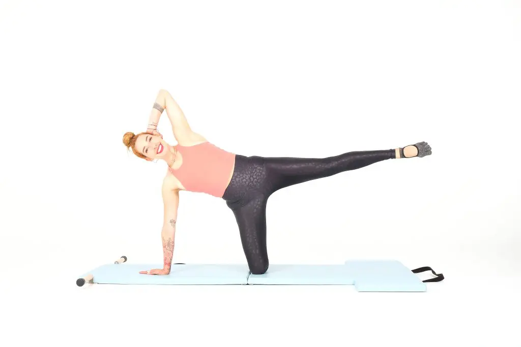 kneeling side kicks on the mat online pilates classes