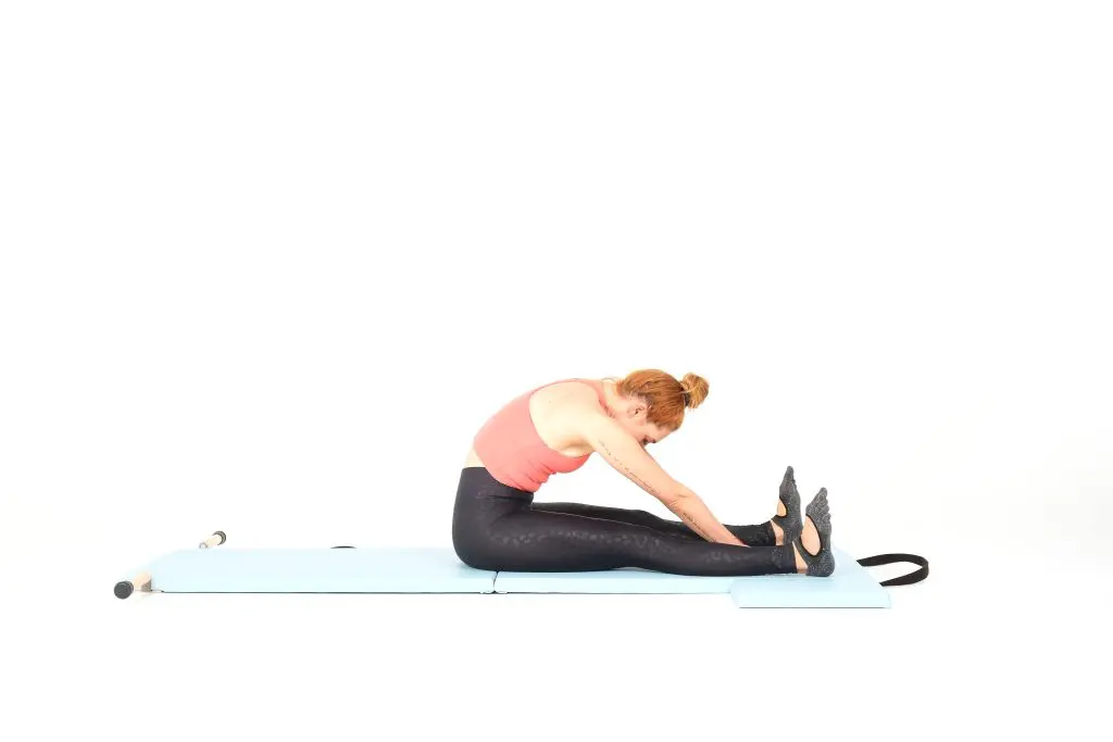 spine stretch forward on the mat online pilates classes