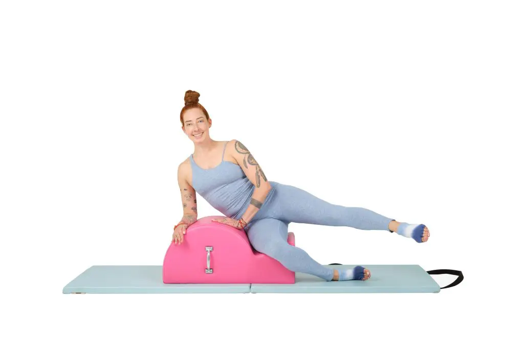 instructor lesley logan using a contrology spine corrector online pilates classes