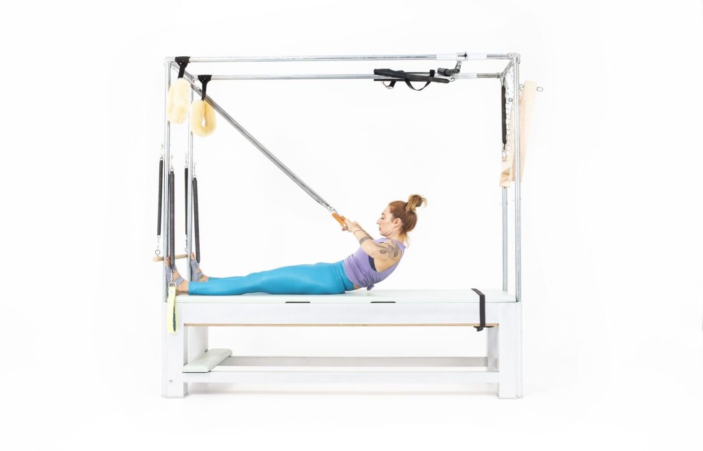 Roll Back with Arm Springs on the Cadillac | Online Pilates Classes