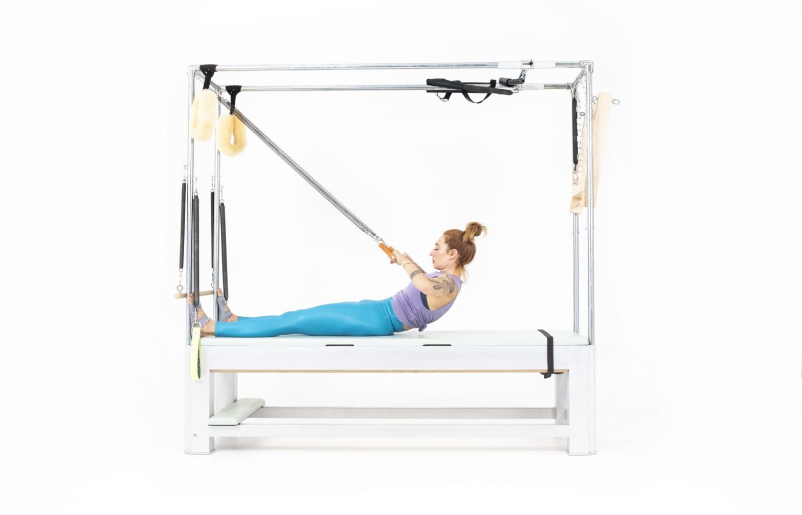 Roll-Back-with-Arm-Springs-on-the-Cadillac-Online-Pilates-Classes