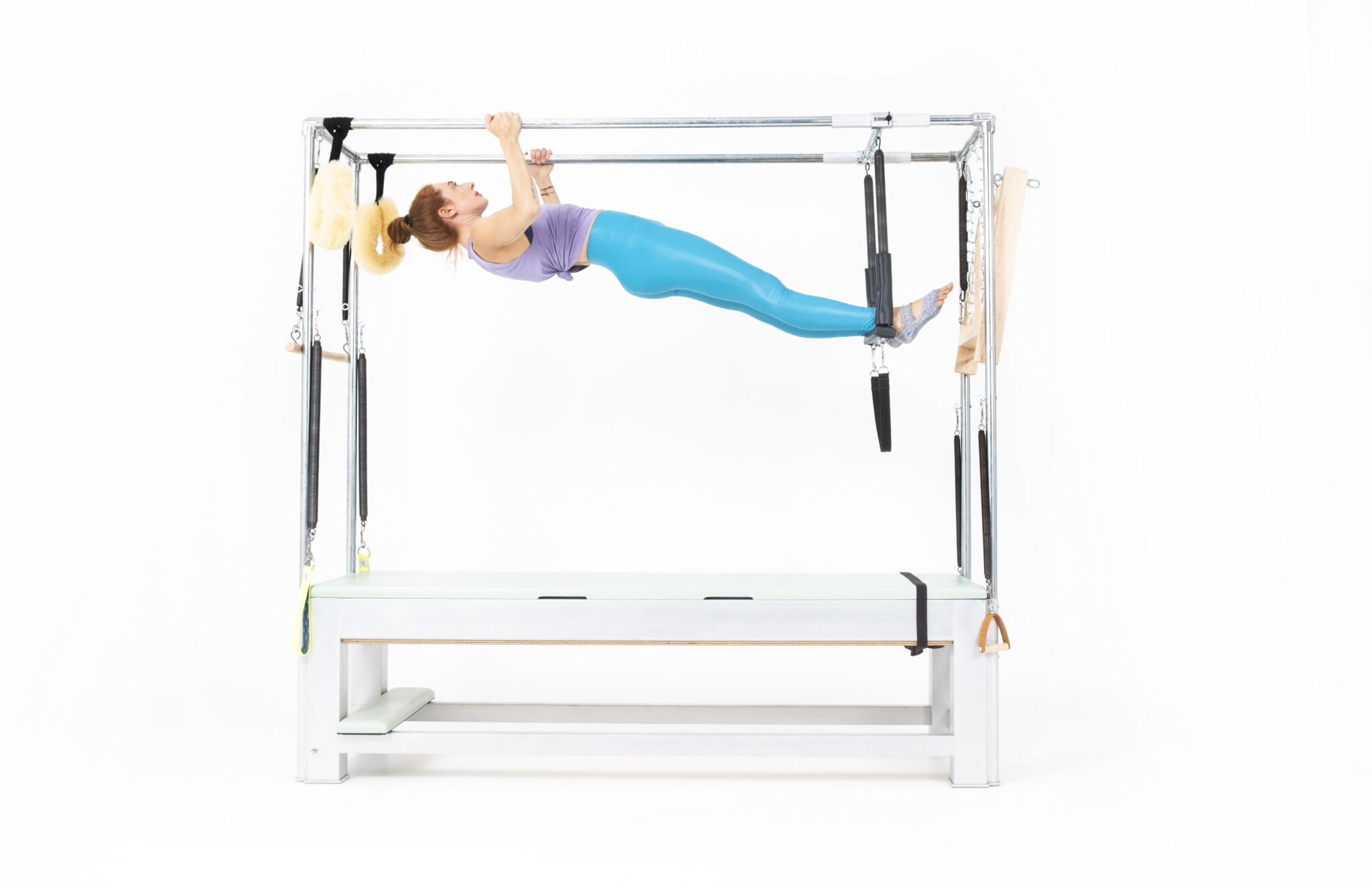 Hanging-Pull-Up-with-Trapeze-on-the-Cadillac Online Pilates Classes