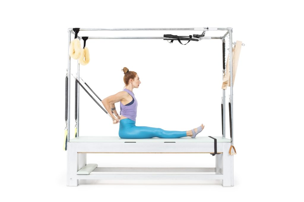 Long Back Arms Seated with Roll Back Bar on the Cadillac or Tower - Online Pilates Classes