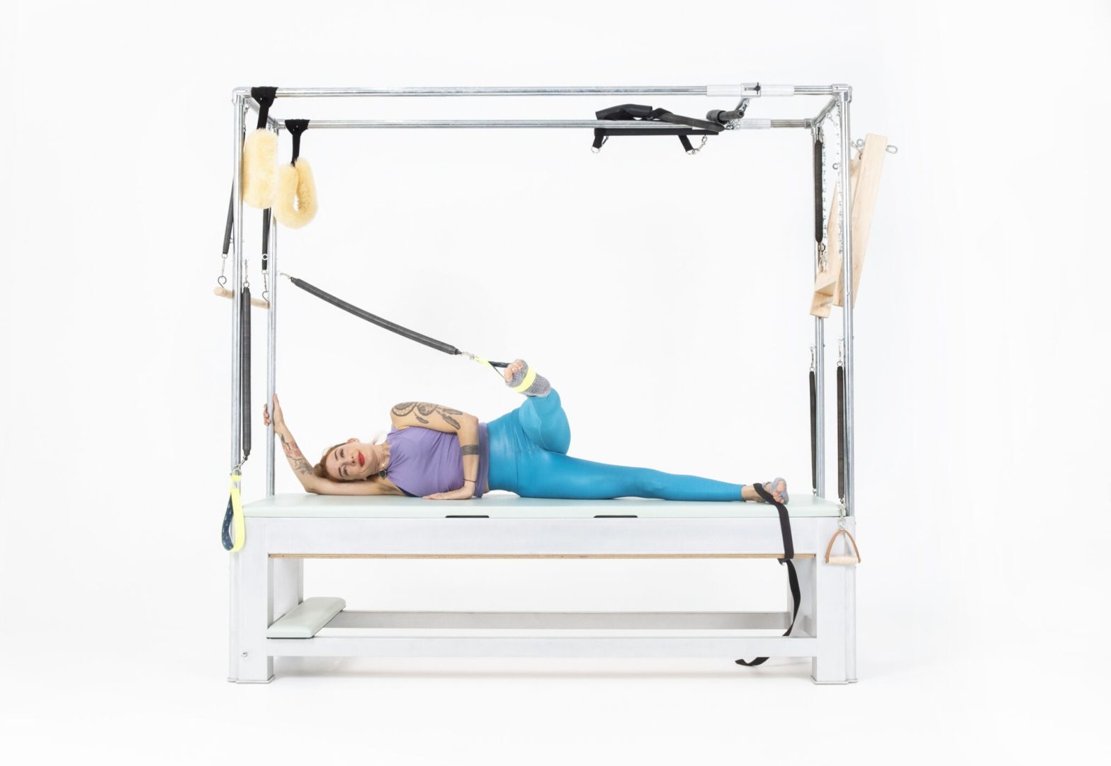 Side-Leg-Springs-Front-Back-on-the-Cadillac-or-Tower-Online-Pilates-Classes-scaled