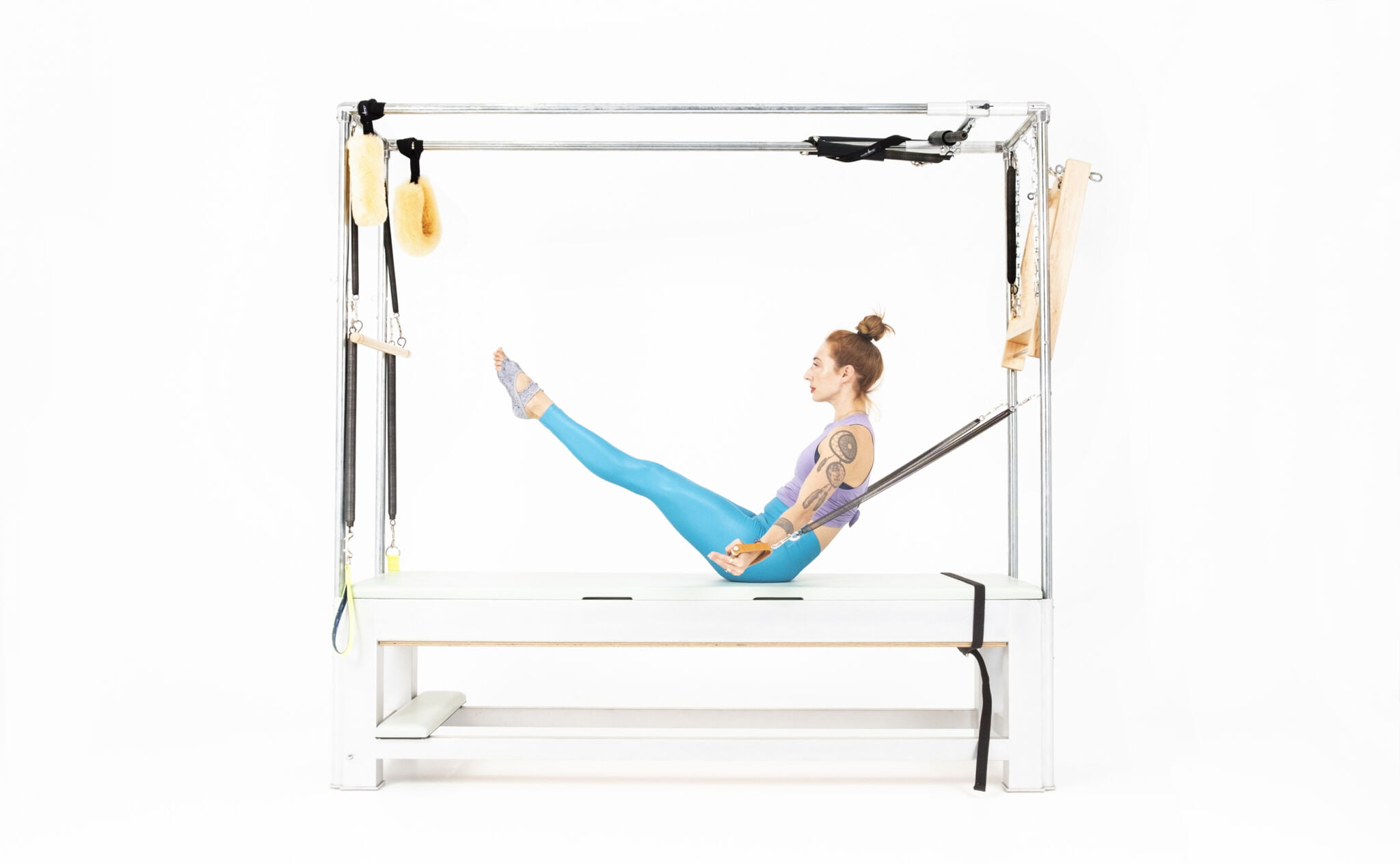 Teaser-with-Arm-Springs-on-the-Cadillac-or-Tower-Online-Pilates-Classes-scaled