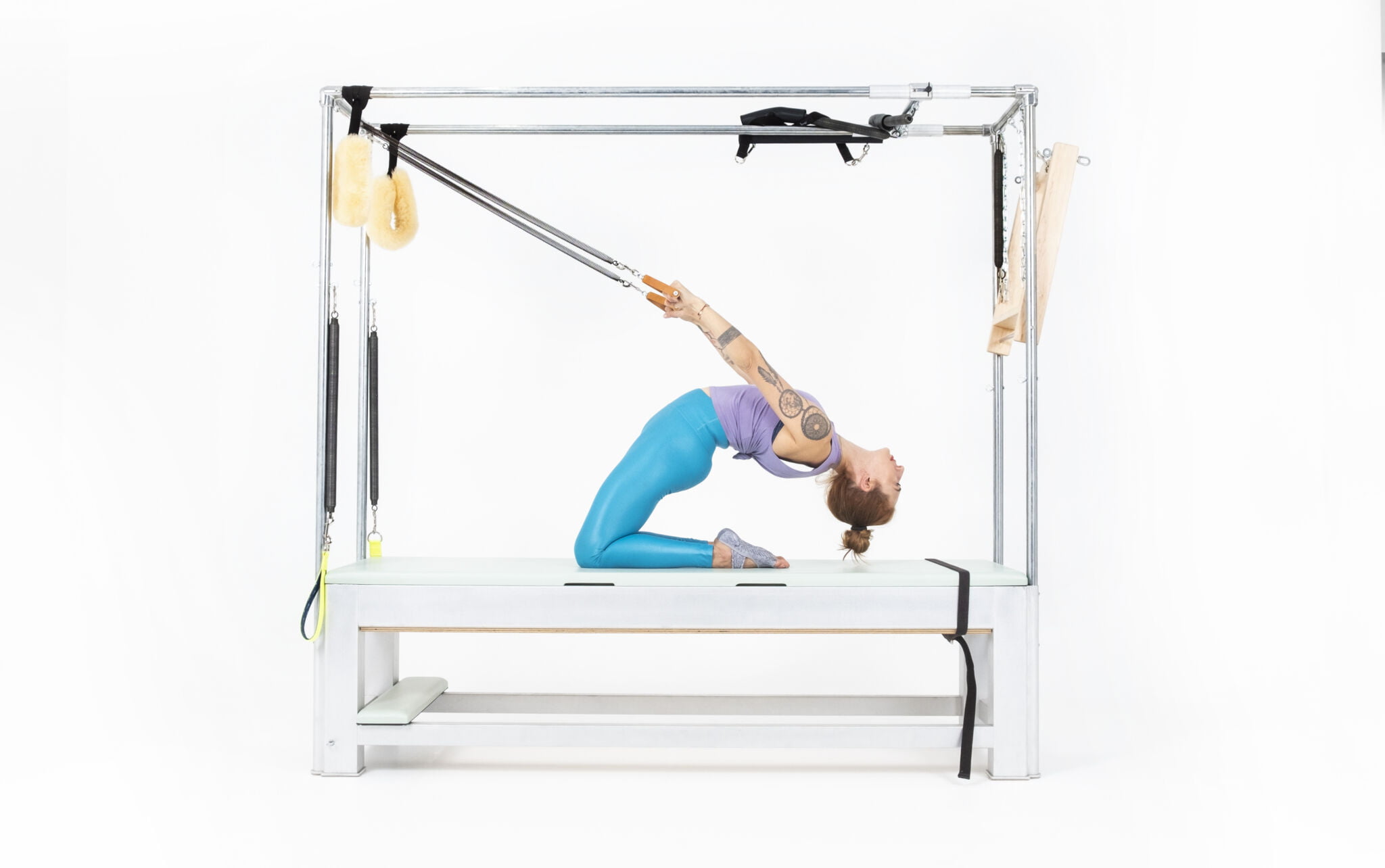 Thigh-Stretch-with-Arm-Springs-on-the-Cadillac-or-Tower-Online-Pilates-Classes-scaled