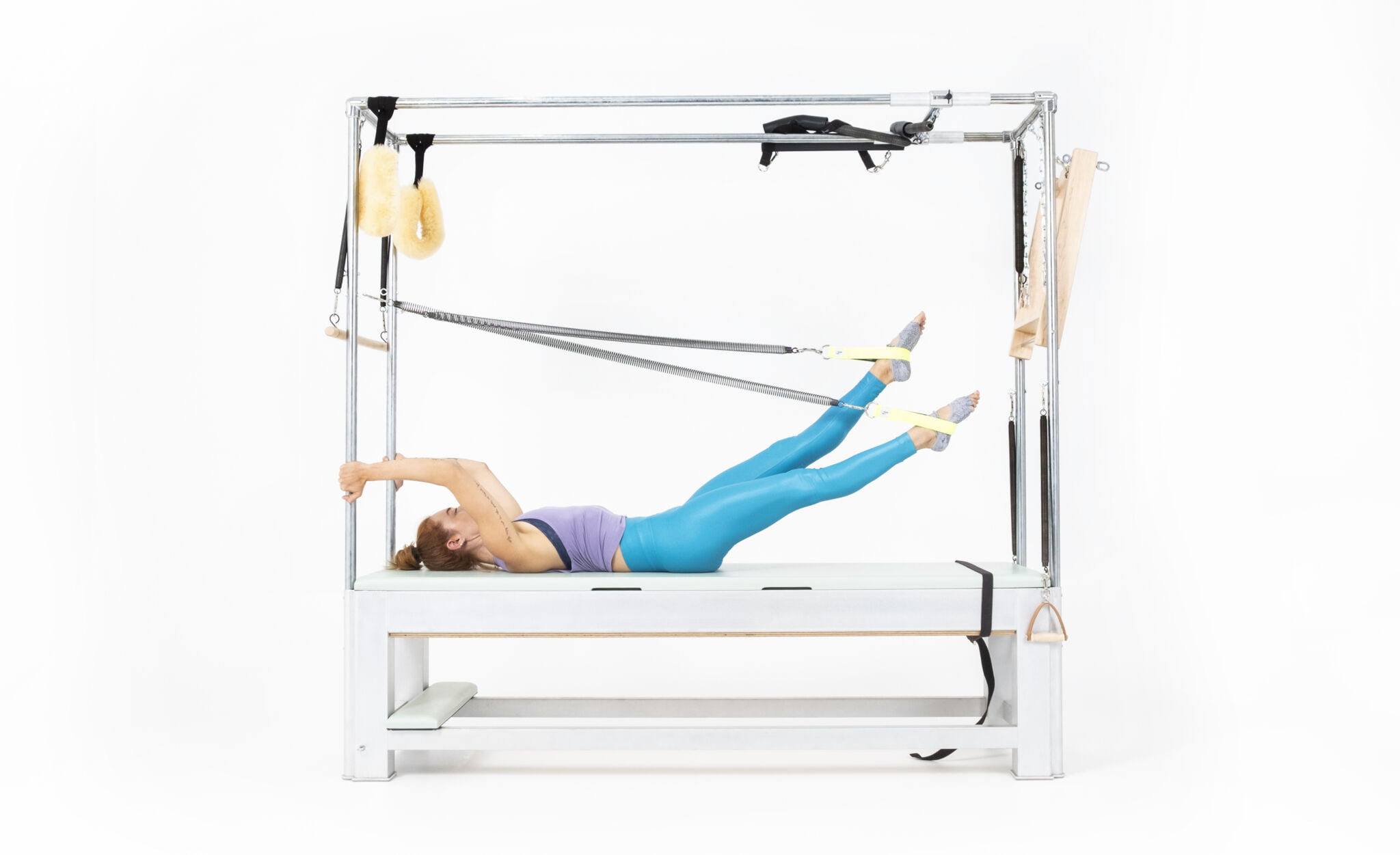 Walking-with-Leg-Springs-on-the-Cadillac-or-Tower-Online-Pilates-Classes-scaled